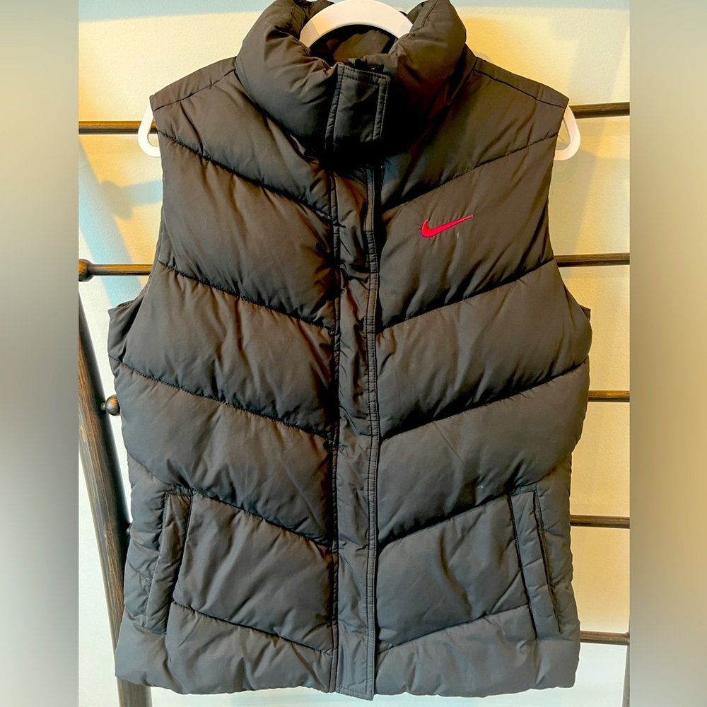 Nike puffer vest.  Black with hot pink swoosh